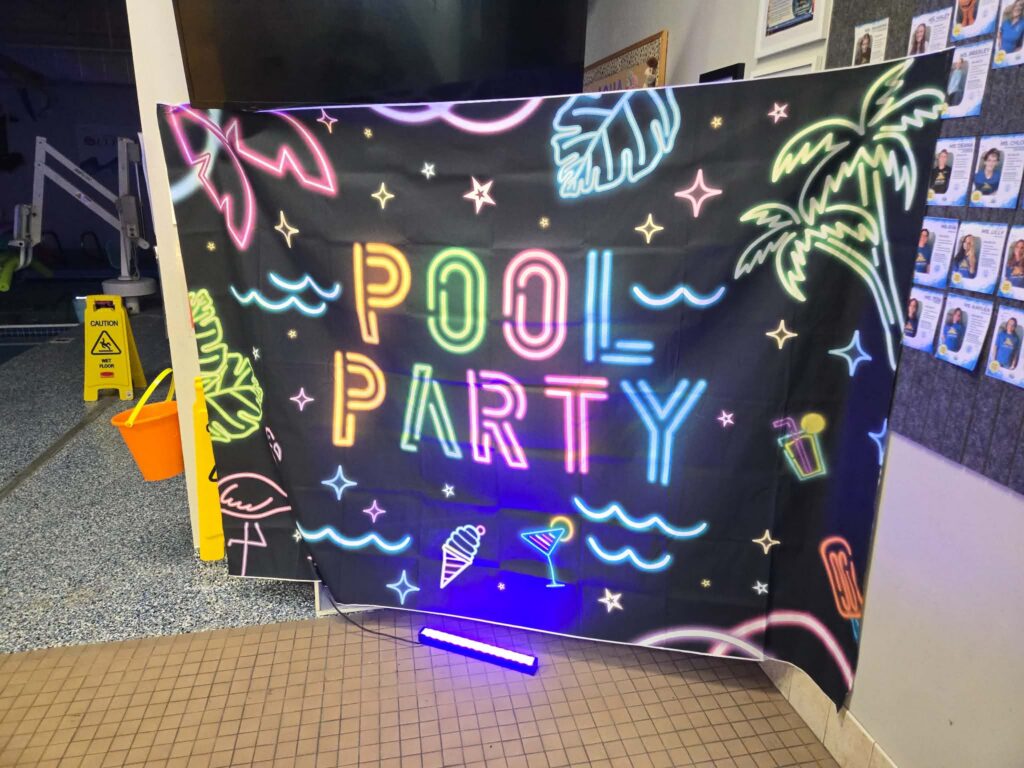 Pool party sign glow party at Little Fins Colorado Springs
