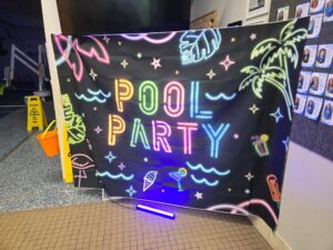 Pool party sign glow party at Little Fins Colorado Springs