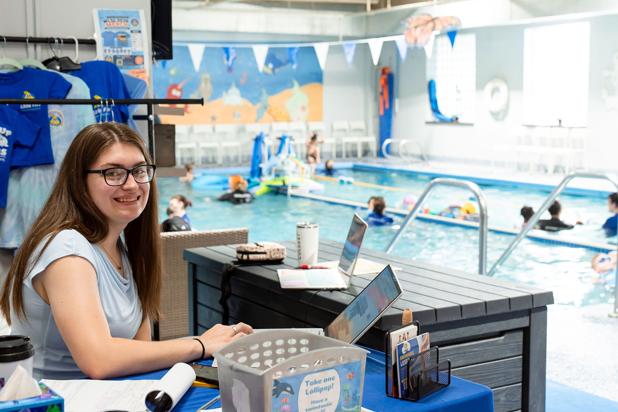 Ms Kim Little Fins October Wave Maker of the Month - behind the desk at Union Location